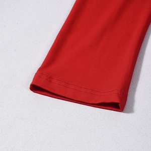 Detailed macro view of the red knitted dress sleeve with durable double-stitched cuffs