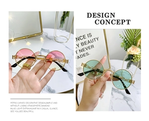 Macro detail of steampunk metal sunglasses with intricate floral frame engravings
