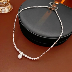 Faceted silver bead necklace with gradient pearls and zircon pendant on jewelry box