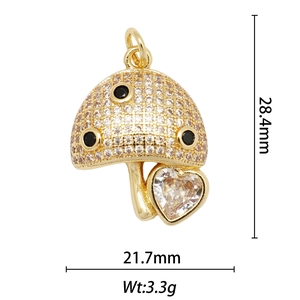 Detail view of 18k gold plated mushroom pendant with dimensions 28.4mm x 21.7mm