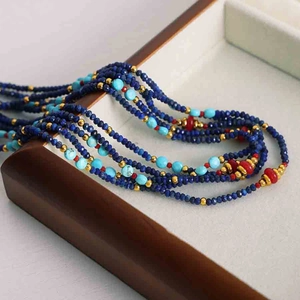 Detail of bohemian multilayer necklace with colorful turquoise and lapis lazuli beads