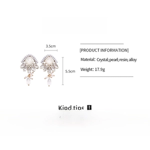 Detailed view of geometric resin pearl earrings with crystal accents and dimensions