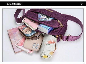 Detail view of purple quilted oxford crossbody bag showing large internal storage capacity