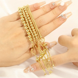 Detail of adjustable slider clasp on 18K gold plated multi-layer bead bracelets