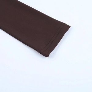 Close-up of double-needle stitching and smooth fabric on deep brown long sleeve cuff