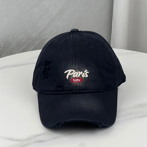 Distressed black baseball cap with Paris 1976 embroidery and vintage washed details