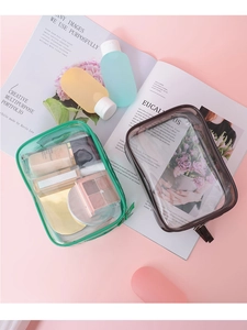 Detailed top view of waterproof PVC makeup bags in green and grey with zipper closures