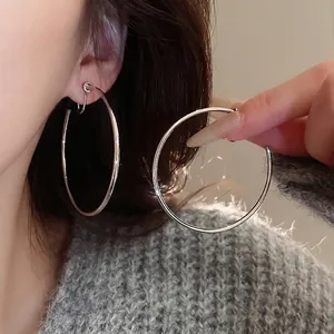 Elegant silver oversized hoop earrings for women with minimalist high-polish metal finish