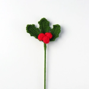 Handmade crochet Christmas holly with deep green leaves and bright red berries on stem