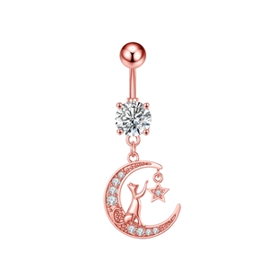 Detailed view of rose gold navel ring featuring a zircon moon, cat silhouette and star