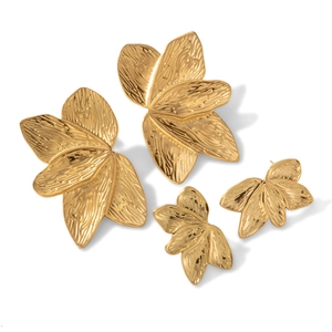 Gold-plated leaf stud earrings with realistic vein textures and layered metal design