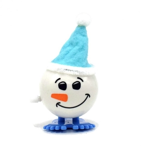 Detail of a wind-up snowman toy with blue felt hat and orange nose for kids