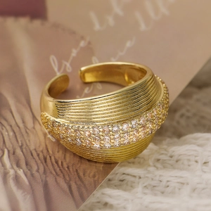 Elegant 18K gold-plated open ring with shimmering cubic zirconia and wavy texture