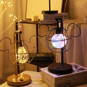 Creative Mickey Mouse shaped LED table lamp in gold and black with warm wire lighting