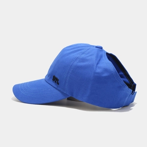 Detail view of the blue sun visor cap featuring DYL embroidery and high ponytail opening