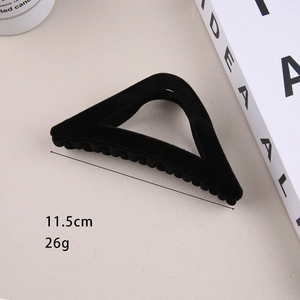 Detail of 11.5cm large black velvet triangle hair claw clip for thick hair styling