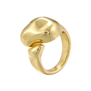 Close-up of a golden geometric irregular star-shaped ring with polished metal finish