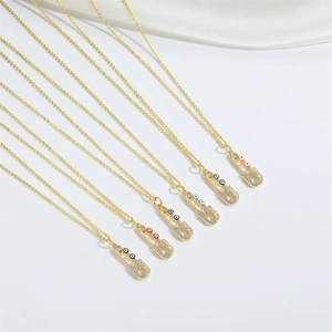 Gold plated evil eye safety pin necklaces with cubic zirconia pavé for women