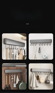 Detail view of gray metal wall hooks used in kitchen, hallway, bathroom and cabinet