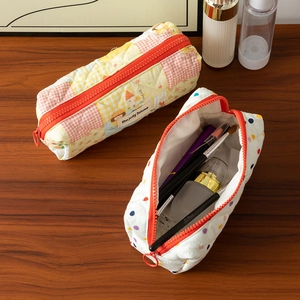Quilted cotton pencil case with large capacity and vibrant orange zipper for stationery