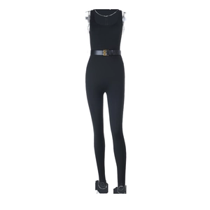 Detail of the slim fit black sleeveless bodysuit with matching gold buckle waist belt