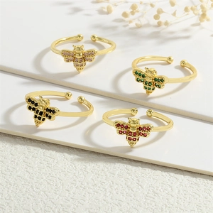 Set of four 18k gold bee rings with colorful zircon inlay and adjustable open band