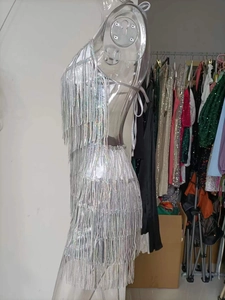 Detail of silver fringe dress with halter neck and shimmering tassels for parties