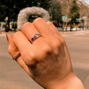 Detailed close-up of mountain peak ring with micro-pave diamonds in rose gold finish