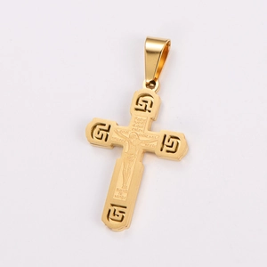 Detail of gold cross pendant with embossed crucifix and Spanish Lord's Prayer engraving