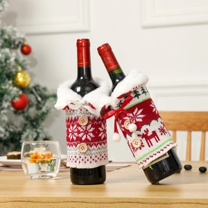 Close-up of knitted Christmas wine bottle cover with faux fur collar and wooden buttons