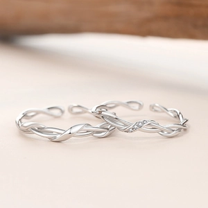 Polished 925 sterling silver Mobius twist couple rings with minimalist and pavé diamond detail