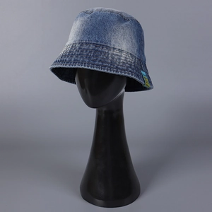 Classic light blue denim bucket hat with decorative patch and vintage washed finish