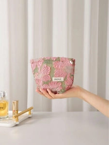 Pink floral embroidery makeup bag with green mesh and secure gold-tone metal zipper