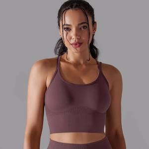 Detail showing high-stretch plum-colored sports bra with wide ribbed elastic underband