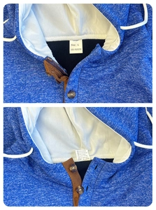 Detail view of the inner neck label showing size L and 100% polyester material info
