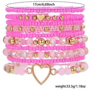 Pink bohemian stackable bead bracelets set with gold heart charm and size details