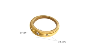 Detail of 18K gold plated stainless steel ring with zircons and star engraving