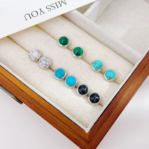 Elegant 5-pair set of colorful round stud earrings in a wooden jewelry display case
