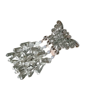 Silver butterfly tassel hair clip with hollow design and dangling beads on white backdrop