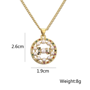 Detailed view of 18K gold tree pendant with pearls and colorful zircons, size 2.6cm x 1.9cm