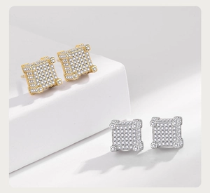 Macro shot of hip hop square stud earrings with pave-set zircon in gold and silver plating