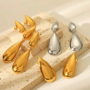 Polished stainless steel water drop earrings in gold and silver finish on stone