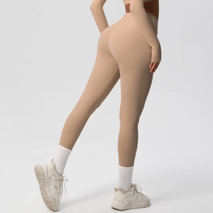 Side view of high-waist skin-friendly yoga leggings and cropped long sleeve sports set