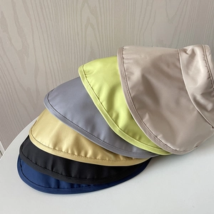 Detail showing various colors of UPF 50+ lightweight sun visors in a stacked layout