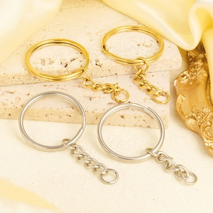 Close-up of gold and silver 18K plated stainless steel key rings with link chains