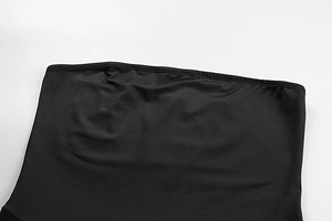 Detailed close-up of smooth black elastic mesh fabric stitching on slim fit dress