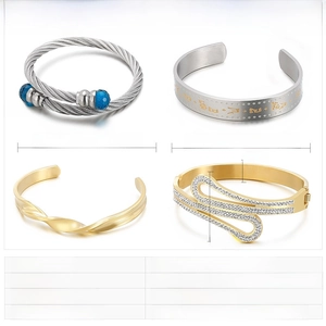 Close-up of four gold and steel bangles featuring crystals and twisted wire designs