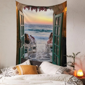 Detail view of Bohemian wall tapestry showing a coastal sunset through a green wooden door