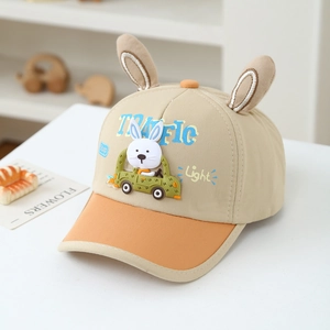 Close-up of kids baseball cap with plush rabbit ears and traffic cartoon prints