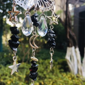 Detailed view of silver butterfly suncatcher with crystal drops and celestial moon charms